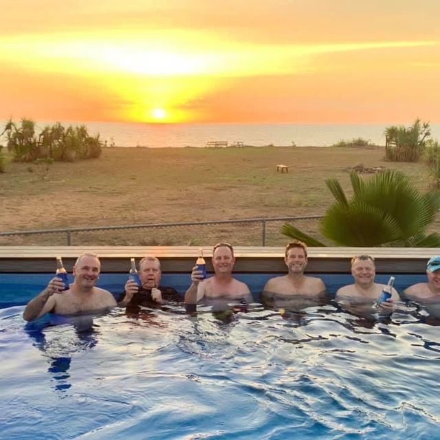 men and sunset